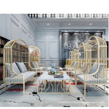 Explosion size custom LOFT light luxury golden bird cage iron sofa hotel rest double sofa table and chair combination